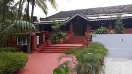 TripThrill Rainbow Wooden Cottages - Goa